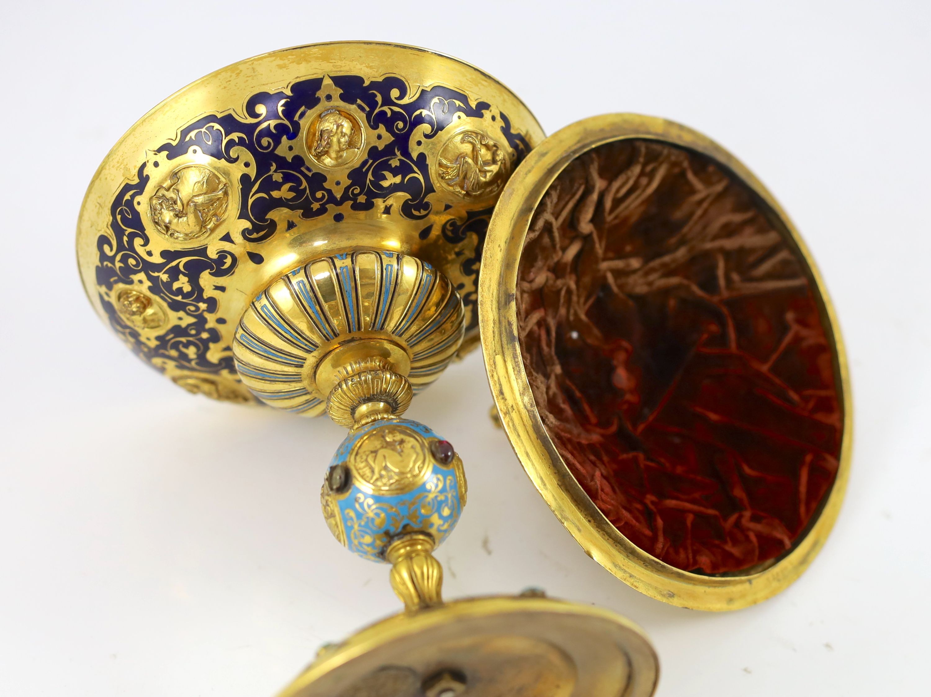 A Victorian enamel and gilt metal pedestal cup and cover in the Renaissance style, Elkington & Co, circa 1880, 24cm high, 14.5cm diameter.